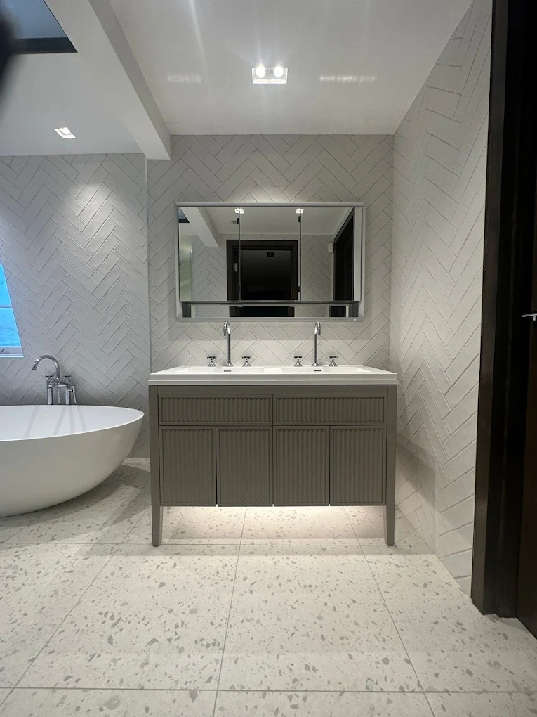 Bathroom renovation — vanity and herringbone tiling